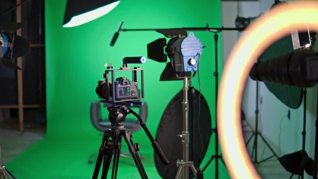 Professional camera on tripod in television broadcast studio