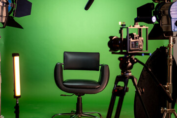 Empty chair in television studio green screen set