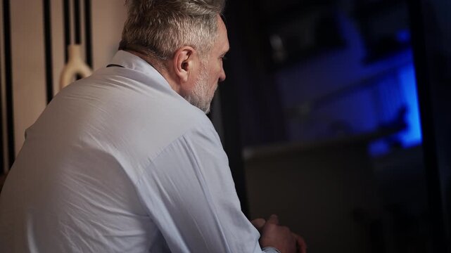 Desperate middle-aged man thinking about his illness and personal problems