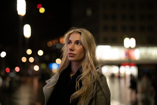 young woman in night city