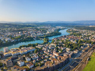 Fototapeta premium Aerial image of Rheinfelden towns in Switzerland and Germany connected with a bridge over the river Rhine
