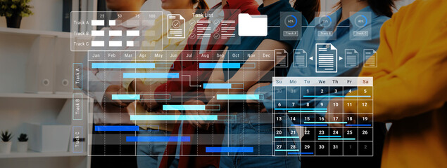 A diverse team stands together in a modern office, utilizing digital tools for project management, enhancing workflow and collaboration for successful outcomes. Gantry