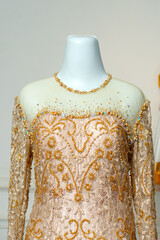 Close Up Gold Lace Modern Kebaya Bodice with Sheer Neckline on Mannequin