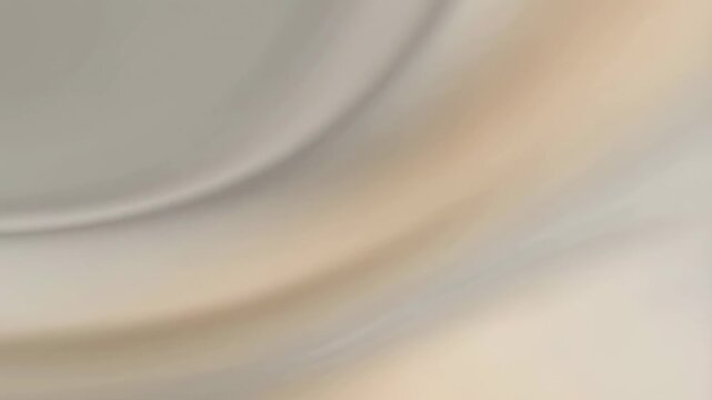 Abstract flowing waves of beige and gray colors creating a soothing visual effect. Ideal for backgrounds, relaxation, and artistic projects