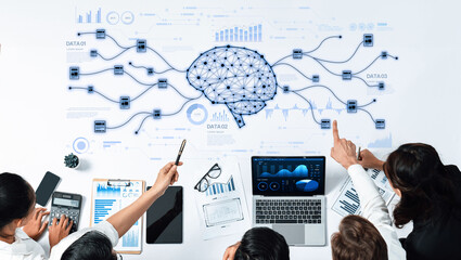 A diverse team works on data analysis atop a table, surrounded by visuals of artificial intelligence, charts, and digital flows, representing modern business innovation. Trope