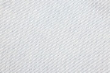 Fototapeta premium Texture of light blue denim fabric as background, top view