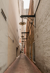 Narrow street in downtown Chicago surrounded by tall buildings and urban architecture, Illinois,...
