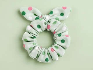Polka dot scrunchie with bow on mint background