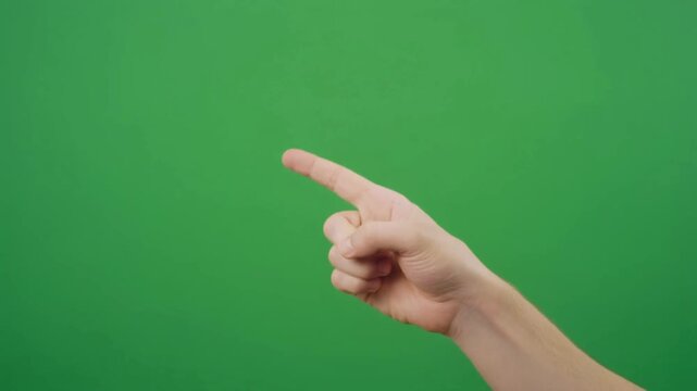Human hand pointing gesture on green screen background for direction instruction call to action and explainer video overlays