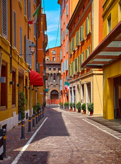 Fototapeta premium Bologna, Italy. Antique streets of old town tower, italian buildings architecture. Sunny day. Popular travel destination in Europe