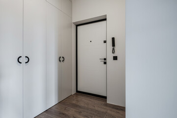 long empty corridor in interior of entrance hall without furniture of modern apartments, office or clinic