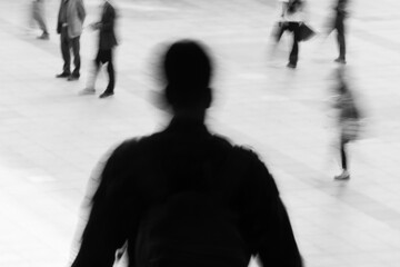 Businessman Silhouette Walking in Urban Crowd 