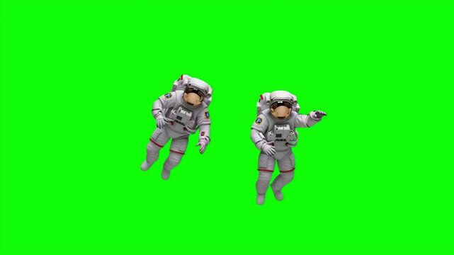 Two Astronauts Floating and Waving in Zero Gravity on Green Screen for Space Exploration Scenes, 4K