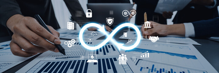 Professionals engage in strategic discussions amid data charts and digital security icons, focusing on business growth and collaboration in a modern office setting. Trope