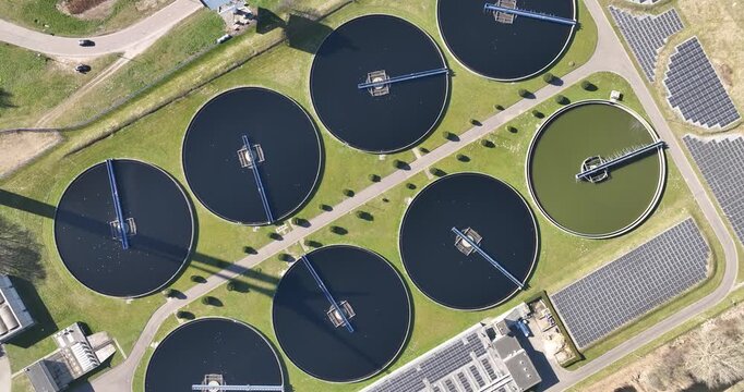 Aerial view of wastewater treatment plant and solar panels