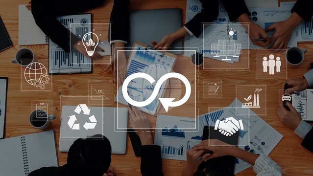 A dynamic business meeting showcasing teamwork and collaboration. Professionals analyze data and discuss sustainable practices in a modern office environment. Raster - Powered by Adobe