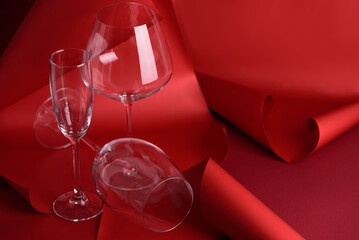 Three Wine Glasses on Sculptural Red Background. Artistic Still Life with Transparency and Form