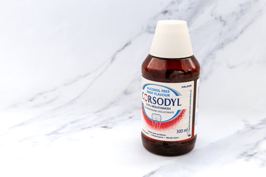 London. UK- January 14.2026. A close up of a bottle of alcohol free, mint flavour Corsodyl mouth wash isolated on a white marble background.