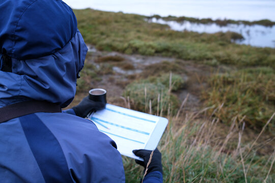 Scientist Gathering Environmental Wetland Conservation Monitoring and Ecological Data