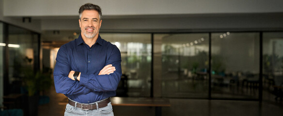 Portrait of happy mature 50 year old professional business owner man manager, smiling senior male...