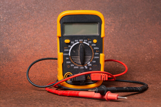 close-up of a multimeter on a brown background