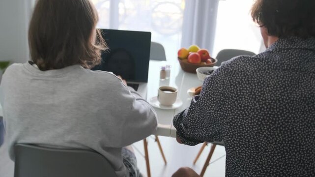 Brothers And Sisters Learning, Sibling Study Session At Home, Family Members Engaged In Group Learning With Coffee Nearby, Two Relatives Working Together On Educational Tasks In Cozy Living Space