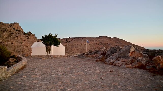 Greek flag near the Chapel of Prophet Elias on Rhodes, Greece