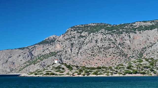 Windmill overlooking the sea near Panormitis on Symi, Greece