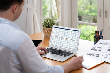 Accounting software on computer screen showing financial statement spreadsheets and account balance...