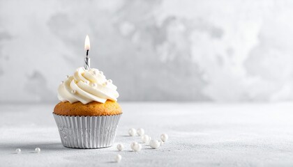 Minimalist Silver Cupcake with White Pearl Sprinkles and Candle on Grey Background
