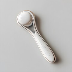Elegant facial massage tool with smooth contours on white background for skincare routines relaxation therapy