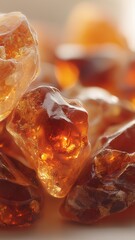 Shimmering amber resin stones with rich golden hues, perfect for luxury fragrance, wellness, and commercial product visuals