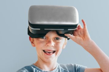 VR headset png mockup, boy playing game, entertainment technology