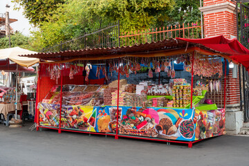 Street stall of typical Mexican sweets in Petatlan, Guerrero. Variety of quince, guava rolls, tamarind, wafers, and artisanal coconut candies. Mexico, January 21, 2026