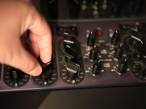 Adjusting Audio Equipment Knobs