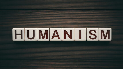 Obraz premium The concept of humanism on wooden background