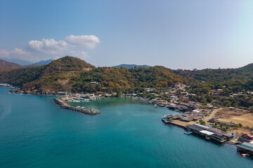 Fototapeta premium defaultAerial view of the beach and small port of Puerto Vicente Guerrero. Fishing boats in the Costa Grande bay. Tecpan de Galeana, Guerrero, Mexico. costa grande