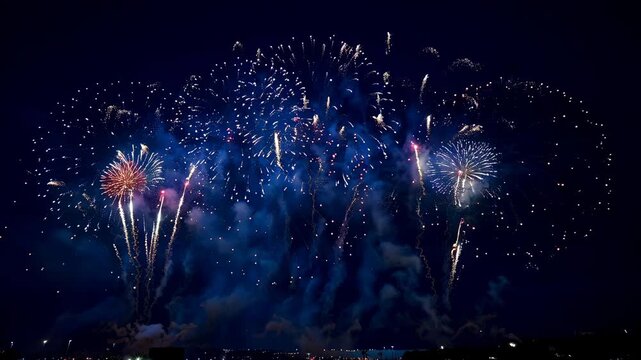 Spectacular fireworks display lighting up the night sky during Independence Day celebration with vibrant colors.