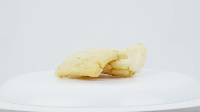 Traditional Asian Crackers Rotating on White Background