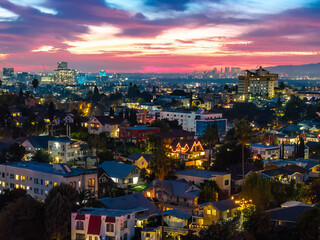 Obraz premium Downtown Los Angeles buildings illuminated at night aerial