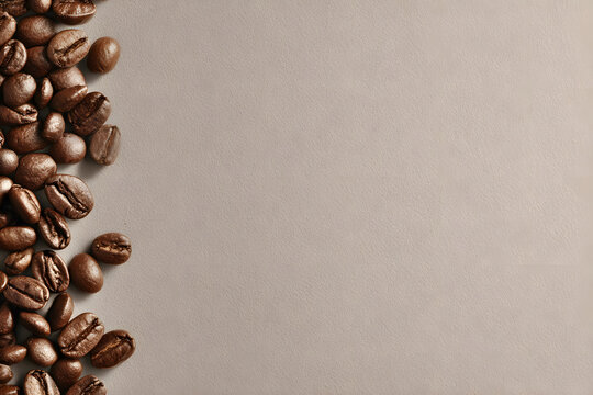Freshly roasted coffee beans spread across a smooth surface during the morning hours in a cozy kitchen