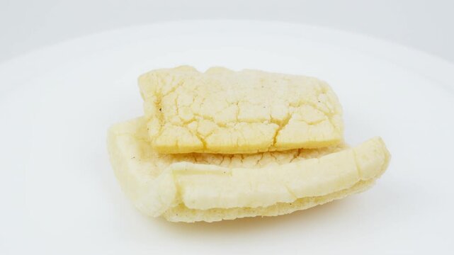 Traditional Asian Crackers Rotating on White Background
