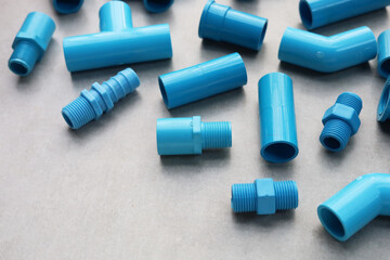 Plumber equipment with blue pvc pipe connections for plumbing work.
