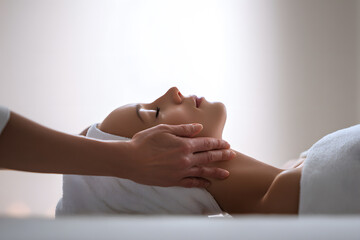 Woman receives facial treatment at spa in a quiet room during a relaxing session