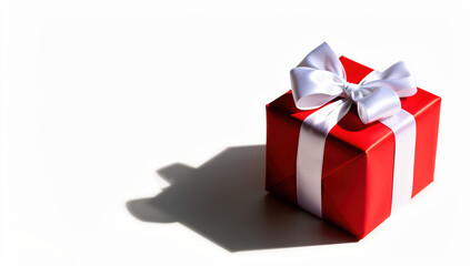Fototapeta premium Red gift box with white ribbon casting shadow 