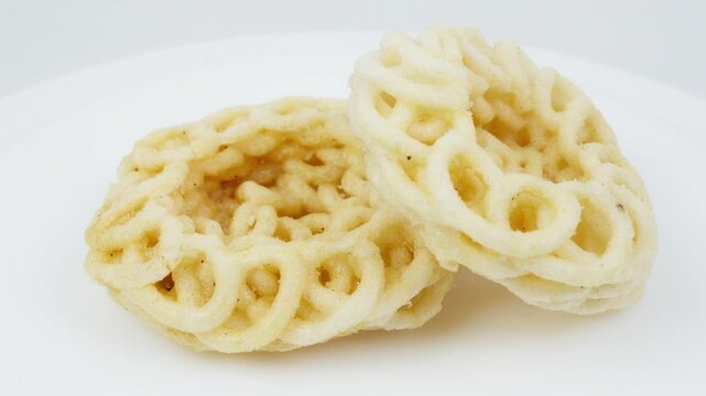 Traditional Asian Crackers Rotating on White Background