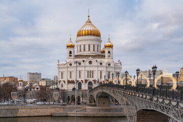 Cathedral of Christ the Savior and the Patriarchal Bridge from the Beresnevskaya embankment of the Moskva River on a sunny winter day, Moscow, Russia