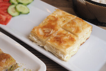 Cheese pastry on a plate with fresh vegetables