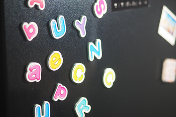 Colorful letters on a fridge show words