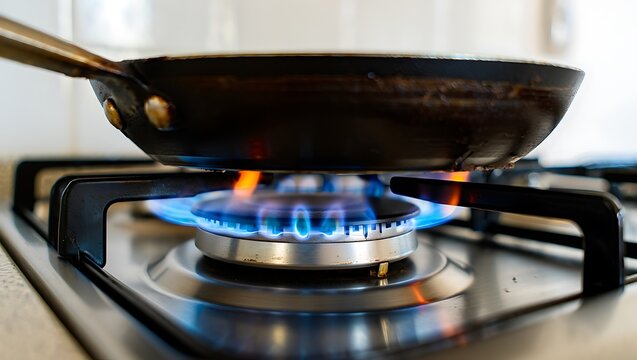 Ultra-realistic close-up photo of a modern gas stove burner with frying pan, blue flames, clean kitchen background, professional lighting, sharp focus, and crisp metallic details.